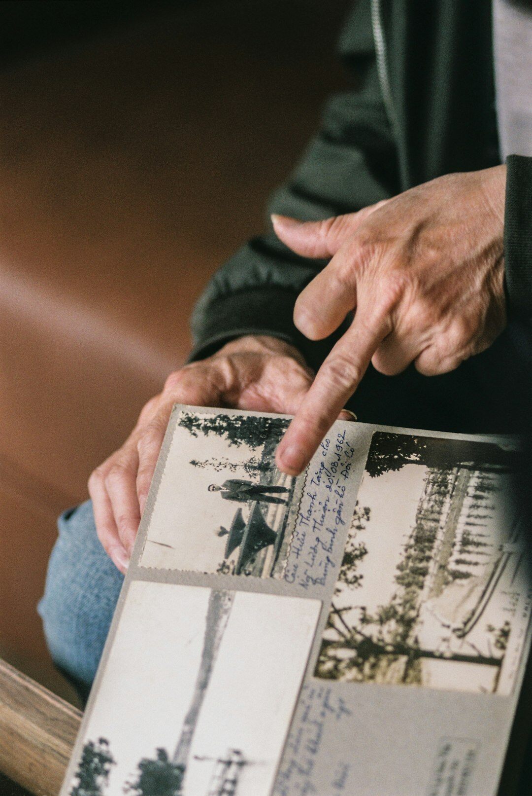 elderly looking at old photo album