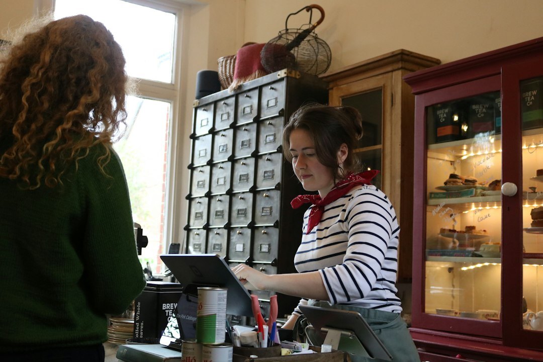 woman running local shop