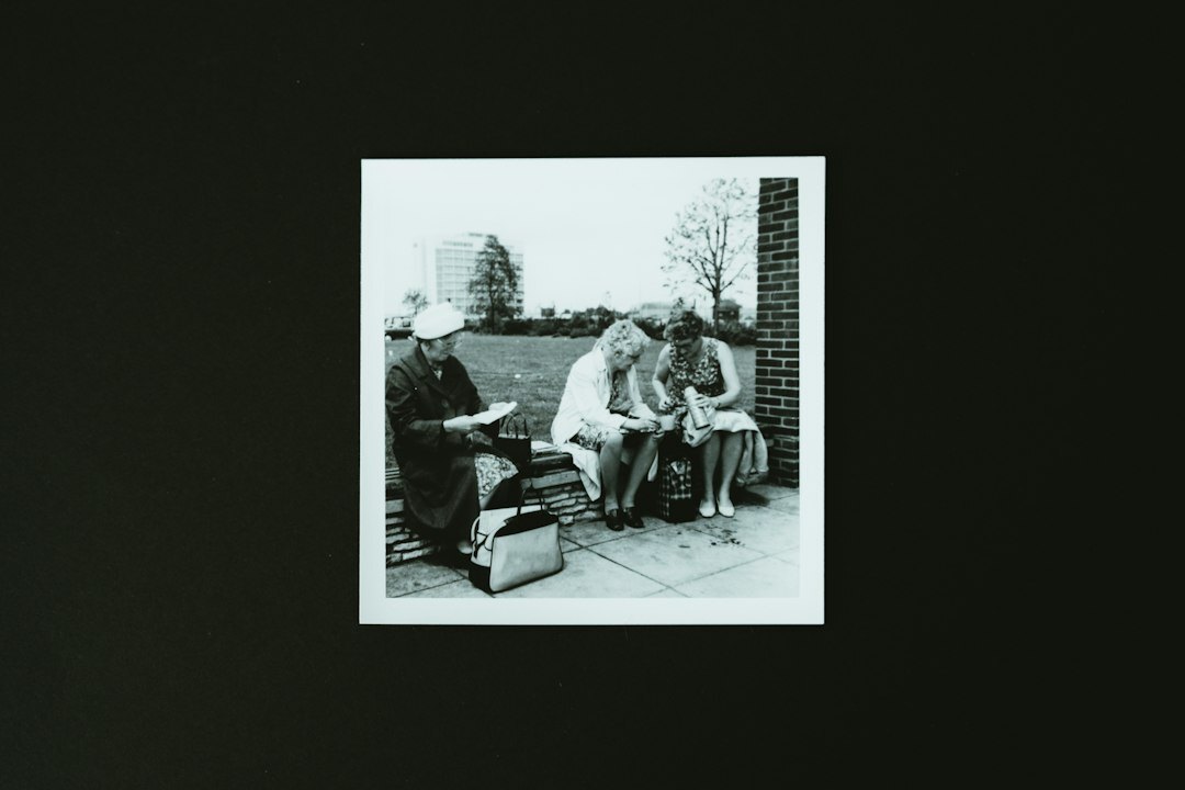 Team of documentary photographers reviewing printed photographs together