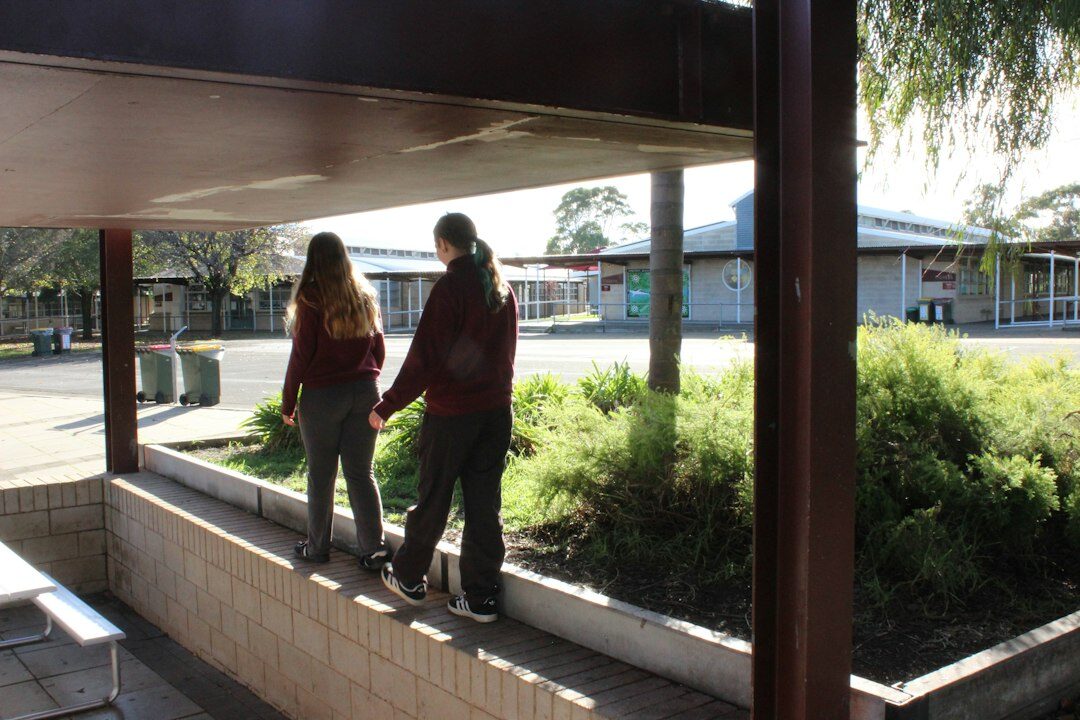 young people chatting in schoolyard